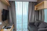 Common Space Cozy Living 1BR Apartment at Grand Kamala Lagoon By Travelio