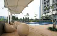 Swimming Pool 7 Nice and Fancy 1BR at Ciputra International Apartment By Travelio