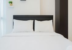 Bedroom 2 Cozy and Strategic Studio Apartment at Capitol Park Residence By Travelio