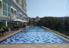 Swimming Pool 5 Pleasurable Studio near UNPAD at Taman Melati Jatinangor Apartment By Travelio