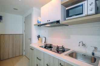 Common Space 4 Fully Furnished with Comfy Design Studio at Grand Kamala Lagoon Apartment By Travelio