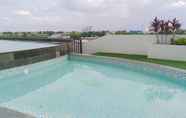 Swimming Pool 5 Comfort Studio Apartment at Patraland Urbano By Travelio