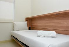 Bedroom 2 2BR Yotayori Home Green Pramuka City Apartment By Travelio