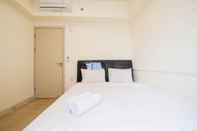 Bedroom Cozy and Tidy 2BR at Meikarta Apartment By Travelio