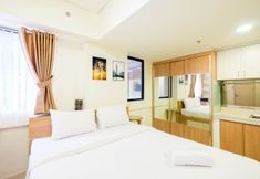 Bedroom 2 Homey and Comfy Studio at Meikarta Apartment By Travelio