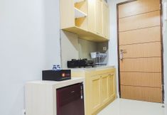 Common Space 3 Minimalist and Comfy Studio at Vida View Apartment By Travelio