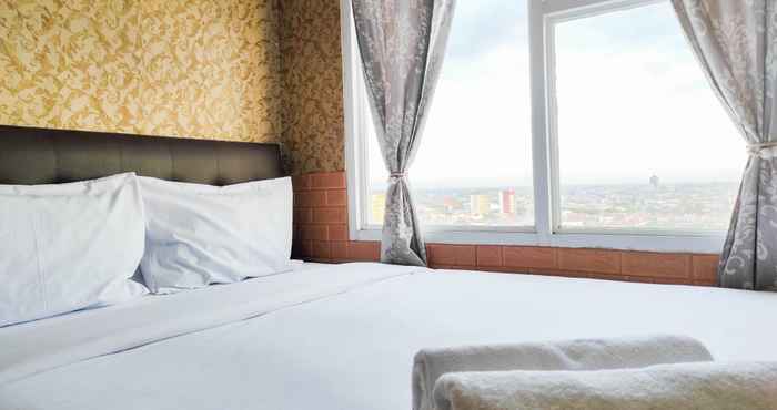 Bedroom Luxurious 2BR Apartment at Vida View Makassar By Travelio