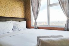 Bedroom Luxurious 2BR Apartment at Vida View Makassar By Travelio