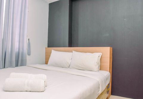 Bedroom Alluring 2BR Apartment near Mall at Bassura City By Travelio