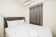 Bedroom Cozy and Homey Living 1BR + Working Room at Meikarta Apartment By Travelio