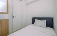 Bedroom 2 Comfort 2BR Bassura City Apartment with City View By Travelio