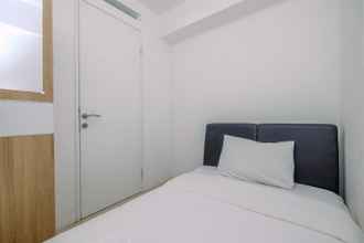 Bedroom 4 Comfort 2BR Bassura City Apartment with City View By Travelio