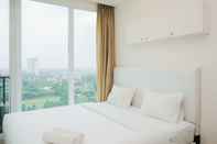 Kamar Tidur Cozy and Homey Studio Room at Tree Park City BSD Apartment By Travelio