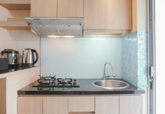 Common Space 4 Fully Furnished with Elegant Design 2BR Apartment at Bassura City By Travelio