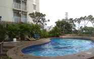 Swimming Pool 7 Minimalist and Homey 2BR at Bogor Valley Apartment By Travelio