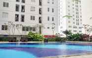 Swimming Pool 7 Comfort and Nice 2BR at Bassura City Apartment By Travelio