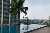 Swimming Pool Modern and Nice 2BR at Daan Mogot City Apartment By Travelio