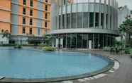 Swimming Pool 7 Fully Furnished with Comfortable Design 1BR at Pejaten Park Residence By Travelio