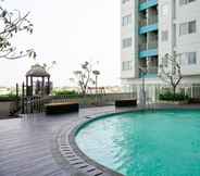 Swimming Pool 5 Cozy and Minimalist 2BR Apartment at The Nest near Puri By Travelio