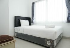 Bedroom 2 Cozy and Minimalist 2BR Apartment at The Nest near Puri By Travelio
