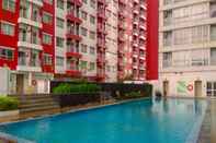 Swimming Pool Simple and Homey Studio Apartment at Taman Melati Margonda By Travelio