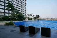 Swimming Pool Luxurious and Comfy 2BR at West Vista Apartment By Travelio