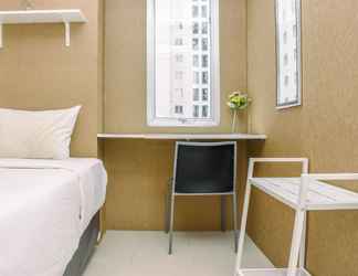 Bedroom 2 Comfortable and Spacious 2BR at Bassura City Apartment near Mall By Travelio