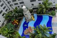 Swimming Pool Comfortable and Spacious 2BR at Bassura City Apartment near Mall By Travelio