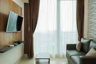 Lobby Cozy and Comfort 1BR at Tree Park City BSD Apartment By Travelio