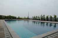 Swimming Pool Cozy and Comfort 1BR at Tree Park City BSD Apartment By Travelio
