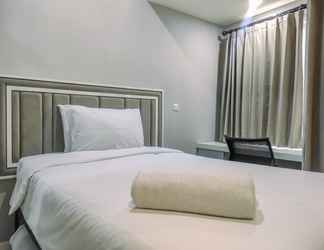 Bedroom 2 Tidy and Comfy 2BR at Vida View Apartment By Travelio