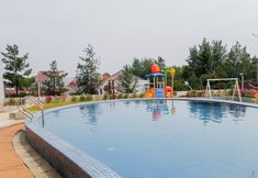 Swimming Pool 4 Cozy Studio Apartment at Amazana Serpong By Travelio