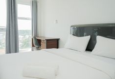 Bedroom 5 Cozy Studio Apartment at Amazana Serpong By Travelio