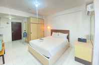 Kamar Tidur Spacious Studio Room Apartment with Sofa Bed at Emerald Towers By Travelio