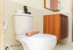 In-room Bathroom 7 Homey and Comfortable 3BR at Meikarta Apartment By Travelio