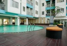 Swimming Pool 5 Enjoy Living Studio at The Nest Puri Apartment By Travelio