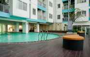 Swimming Pool 5 Enjoy Living Studio at The Nest Puri Apartment By Travelio