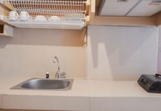Common Space 3 Enjoy Living Studio at The Nest Puri Apartment By Travelio
