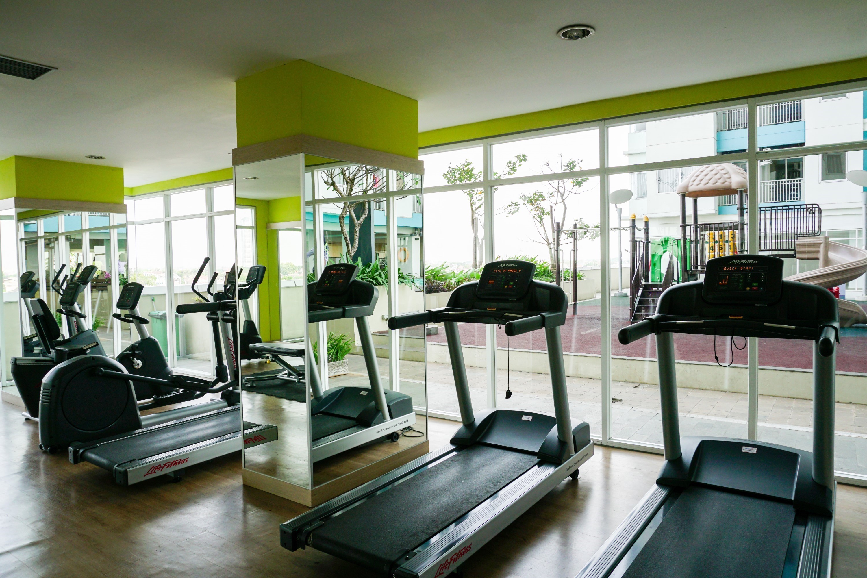 Fitness Center 7 Enjoy Living Studio at The Nest Puri Apartment By Travelio