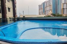 Swimming Pool Cozy and Nice 2BR Apartment at Atria Residence By Travelio
