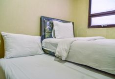 Bedroom 2 Cozy and Nice 2BR Apartment at Atria Residence By Travelio