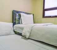 Bedroom 2 Cozy and Nice 2BR Apartment at Atria Residence By Travelio