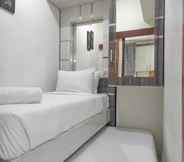 Bedroom 2 Cozy and Best Deal 2BR Vida View Apartment By Travelio