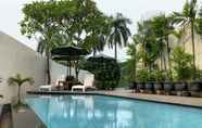 Swimming Pool 6 Comfy and Simple 1BR at Palm Court Apartment By Travelio