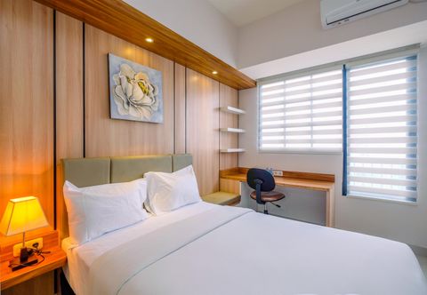 Bedroom Cozy Living Studio near UI at Evenciio Apartment Margonda By Travelio