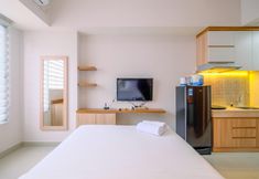 Common Space 2 Cozy Living Studio near UI at Evenciio Apartment Margonda By Travelio