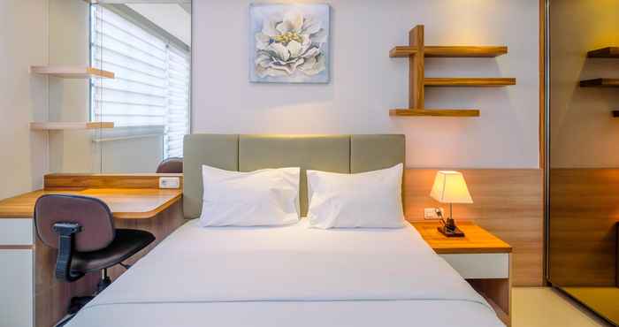 Bedroom Elegant Studio Room at Evenciio Apartment Margonda By Travelio