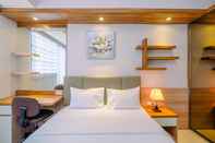 Bedroom Elegant Studio Room at Evenciio Apartment Margonda By Travelio