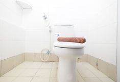 In-room Bathroom 4 Cozy and Spacious 1BR Bassura City Apartment By Travelio