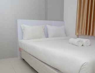 Bedroom 2 Strategic 2BR Apartment at Bassura City By Travelio